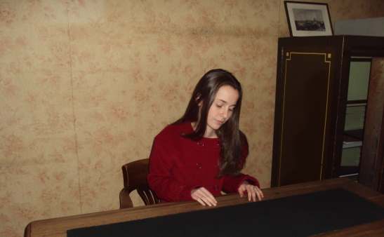 Julia Belanoff at the Anne Frank desk