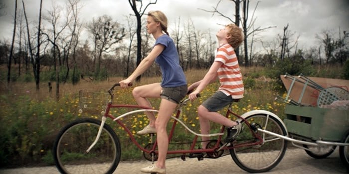 Jonathan and his mother riding on