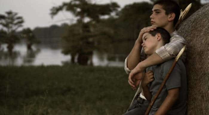 Robbie Hendrick (William Ruffin) and his half-brother Fess Hendrick (John Alex Nunnery)