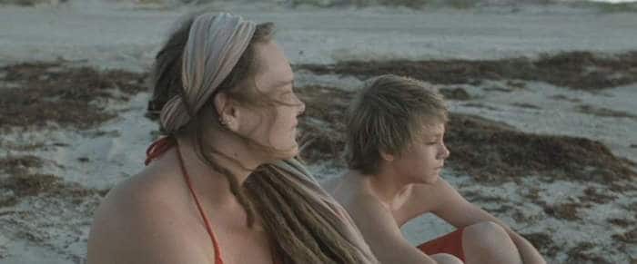 Daniel Blanchard as The Boy and Melissa McKinney as The Mother, by the sea.