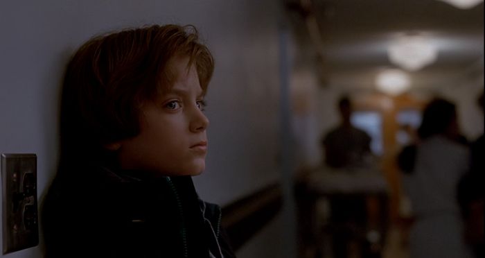 Elijah Wood’s pensive look in The Good Son (1993) reflects Mark’s unease