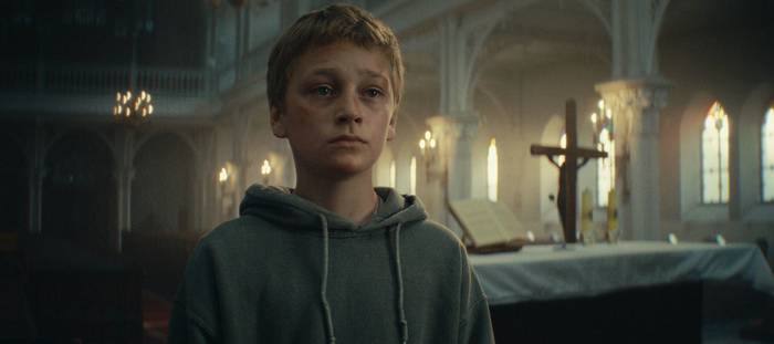 Tobiasz Wajda delivers a quietly powerful performance as Filip