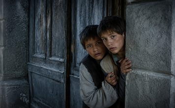 The Notebook (A nagy füzet) Review: A Bleak Ode to the Loss of Innocence The twin brothers peer out at a world they are only beginning to understand—a quiet image that belies the emotional brutality to come.