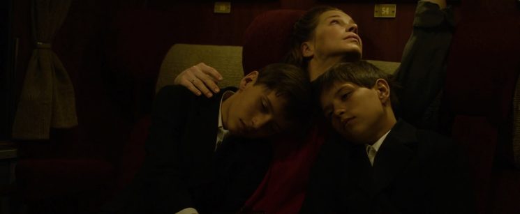 Introduced in moments of quiet vulnerability, the twins soon become witnesses to a world that demands emotional survival above all else.